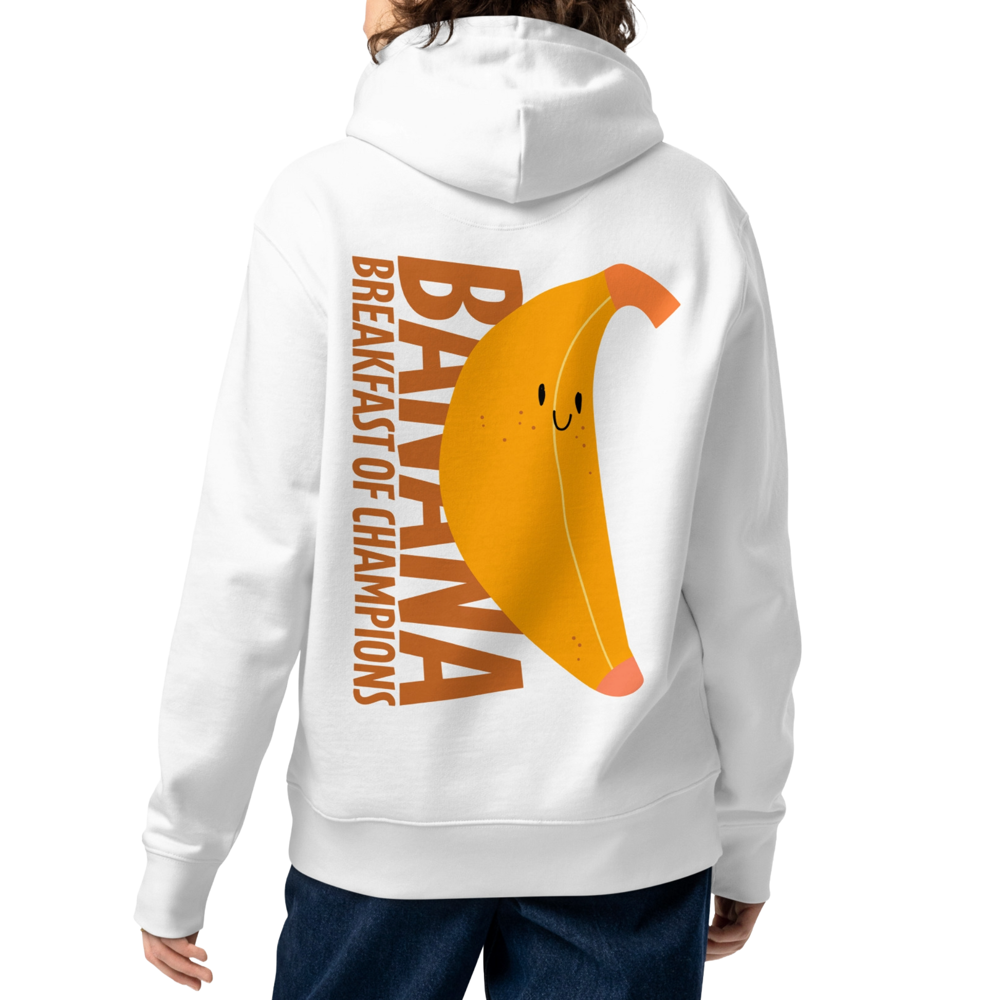A person shown from the back wearing an organic hoodie in white by Lane Line Threads with a smiling banana and "Banana Breakfast Champion" text graphic, made from GOTS and OCS certified organic cotton.