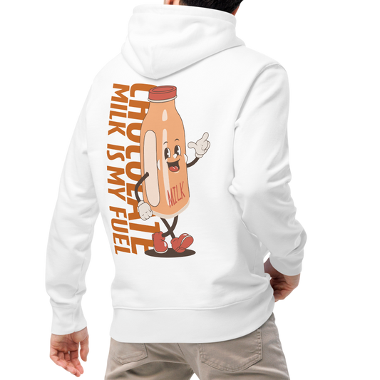 A man shown from the back wearing an organic hoodie featuring a "Chocolate Milk is My Fuel" retro cartoon milk bottle graphic on the back of a white GOTS certified sweatshirt, paired with beige pants and white sneakers, against a plain white background.