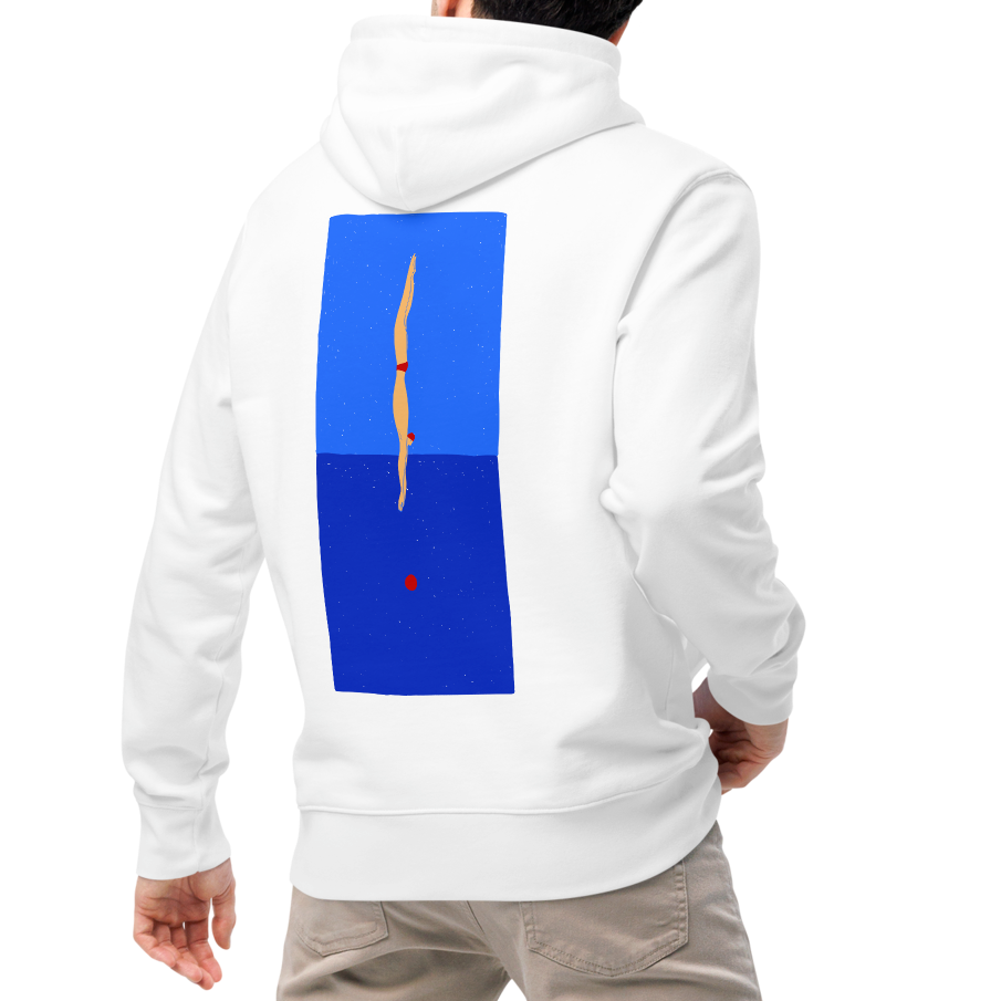 A man viewed from behind wearing an organic hoodie in white with blue back graphic showing a swimmer diving into water, designed by Lane Line Threads for post-swim comfort, paired with beige pants and white sneakers, against a plain white background.