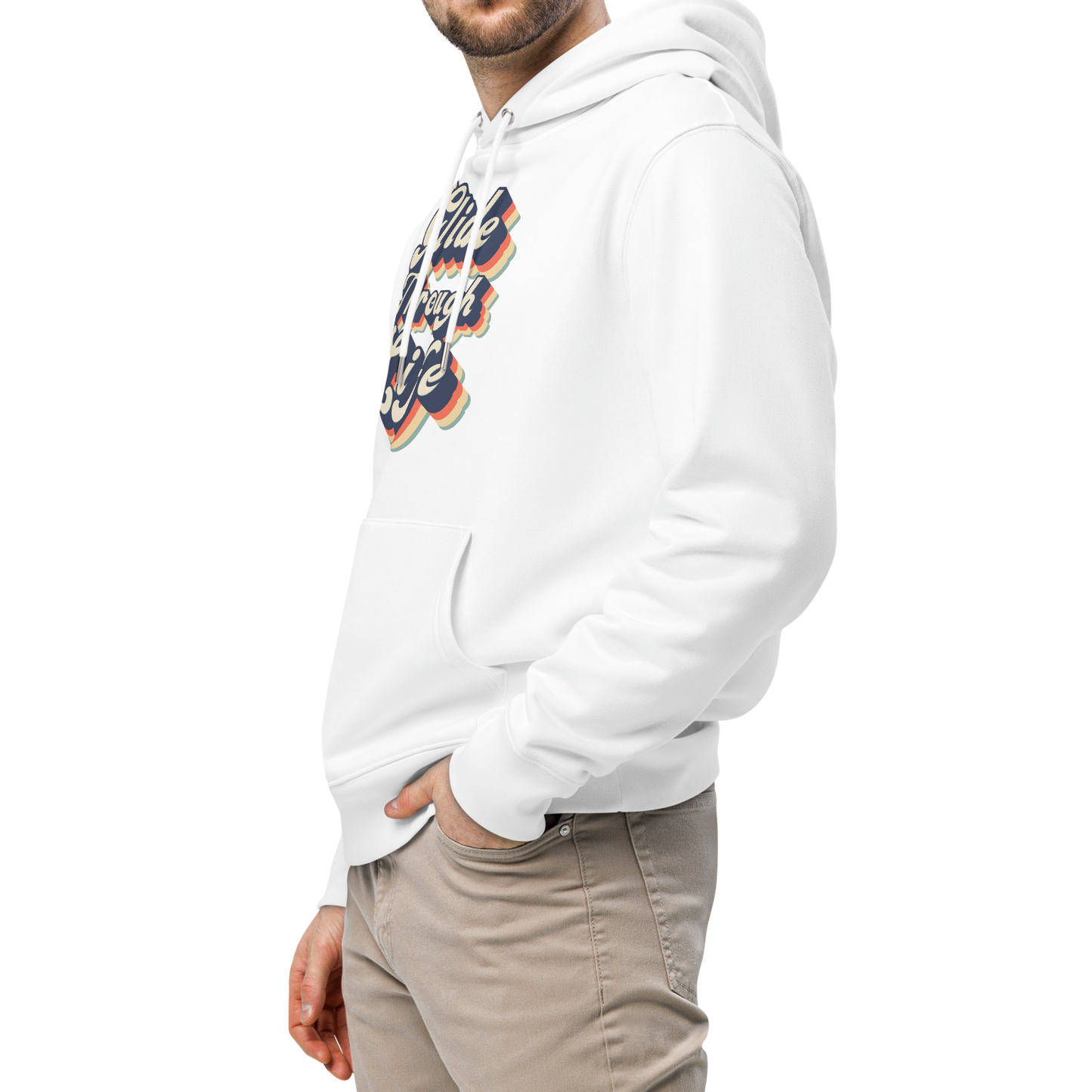A man wearing an organic hoodie with "Glide Through Life" retro 3D typography on white GOTS and OCS certified cotton, designed for swimmer recovery paired with beige pants, photographed against a solid white background