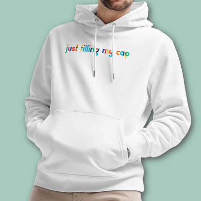 Organic hoodie in white by Lane Line Threads with colorful “just filling my cap” text on the chest, made from GOTS and OCS certified organic cotton, shown on a model against a solid mint green background.