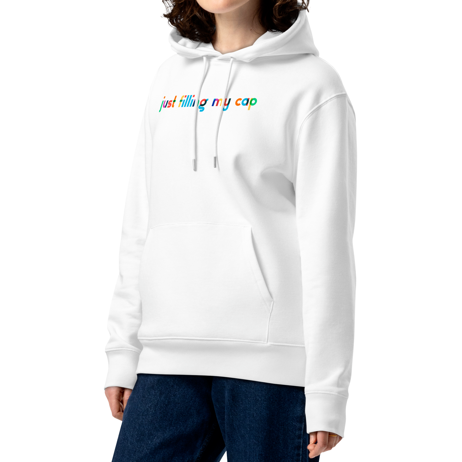 Person wearing an organic hoodie in white by Lane Line Threads with colorful “just filling my cap” text on the chest, made from GOTS and OCS certified organic cotton.