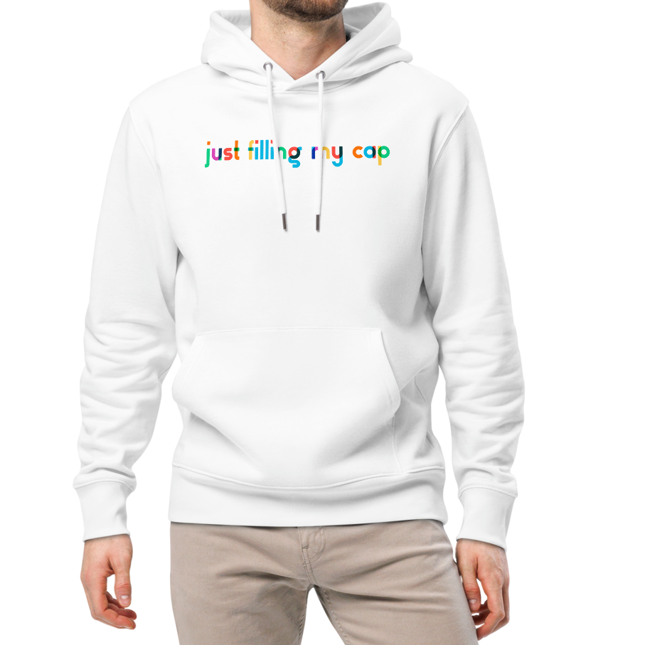 A man wearing an organic hoodie in white by Lane Line Threads with colorful “just filling my cap” text on the chest, made from GOTS and OCS certified organic cotton.