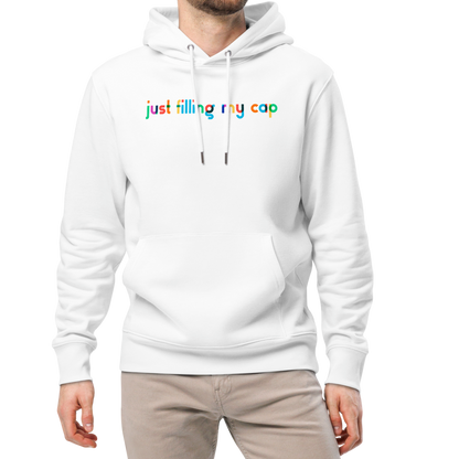 A man wearing an organic hoodie in white by Lane Line Threads with colorful “just filling my cap” text on the chest, made from GOTS and OCS certified organic cotton.