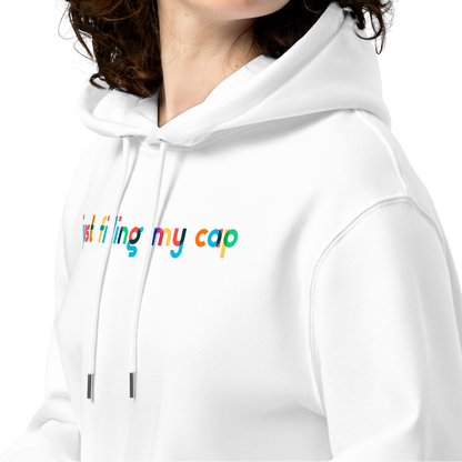 Person wearing an organic hoodie in white by Lane Line Threads with colorful “just filling my cap” text on the chest, made from GOTS and OCS certified organic cotton showing product details