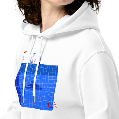 A woman with curly brown hair wearing an organic hoodie in white by Lane Line Threads featuring a graphic of a diver, potted plants, and a shark silhouette in a blue pool shown against a plain white background.