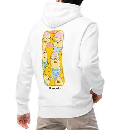 A man wearing a white organic hoodie by Lane Line Threads shown from the back, featuring a large graphic print of cartoon yellow swim chicks wearing pink caps and blue swim trunks, with the text 'Sink or swim' printed below the graphic, paired with beige pants and white sneakers, shown from behind against a plain white background.