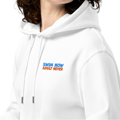 Female person wearing a white organic hoodie with the embroidered text "swim now adult never" by Lane Line Threads designed for post-swim skin health and GOTS certified comfort.