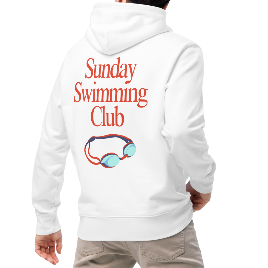 A man viewed from behind wearing an organic hoodie white Lane Line Threads sweatshirt with Sunday Swimming Club text and swim goggles graphic on the back, paired with beige pants and white sneakers, against a plain white background.