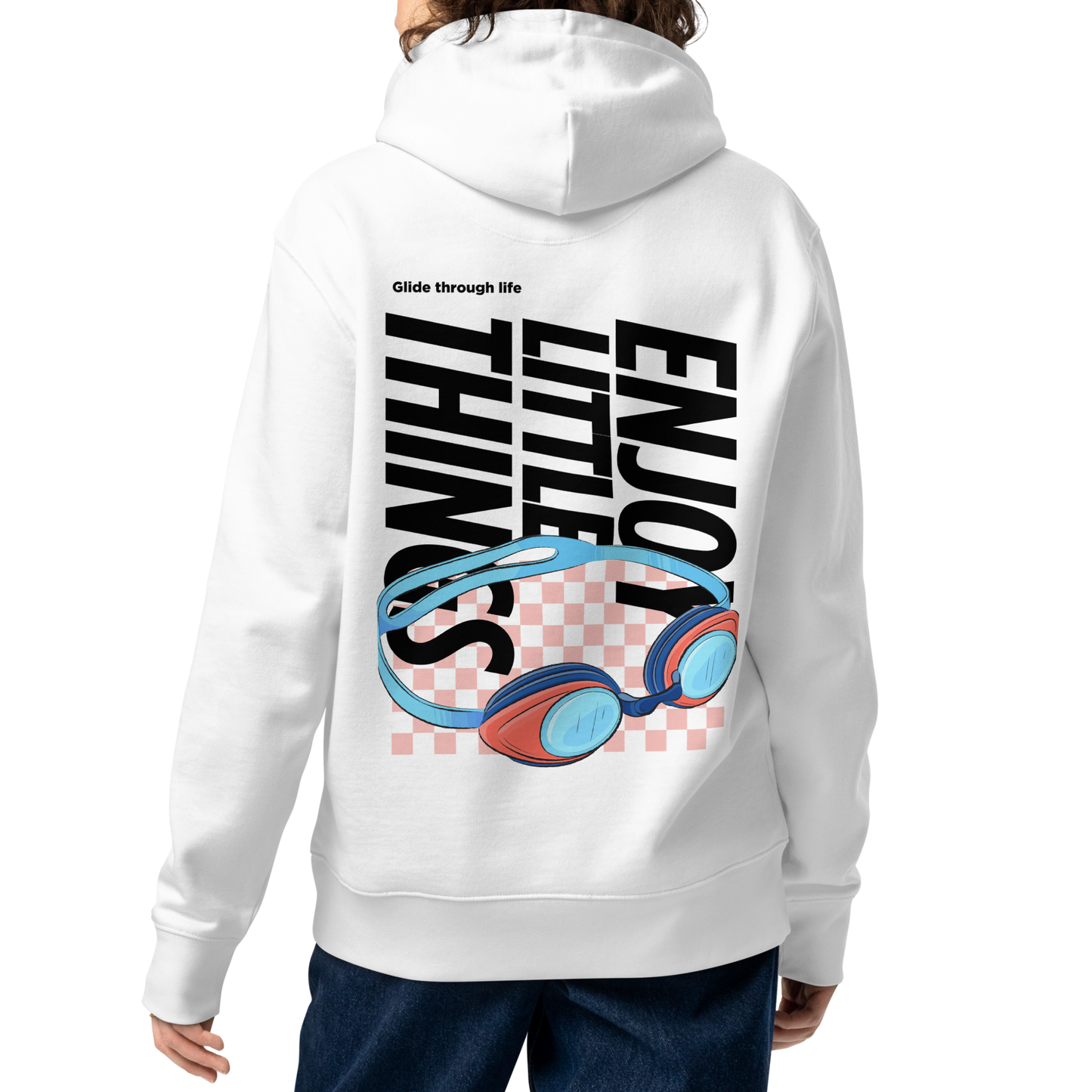A female model shown from the back wearing an organic hoodie in white with colorful swim goggles and bold graphic text on the back, made from GOTS and OCS certified organic cotton