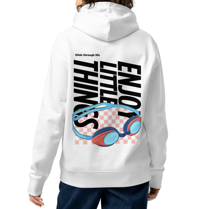 A female model shown from the back wearing an organic hoodie in white with colorful swim goggles and bold graphic text on the back, made from GOTS and OCS certified organic cotton