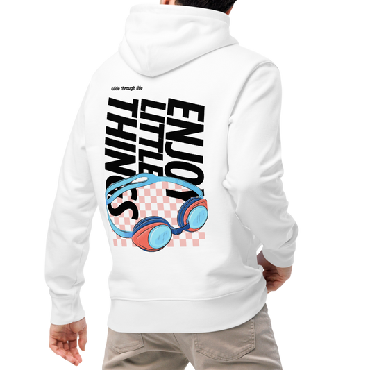 A man shown from the back wearing an organic hoodie in white with colorful swim goggles and bold graphic text on the back, made from GOTS and OCS certified organic cotton, paired with beige pants and white sneakers, against a plain white background