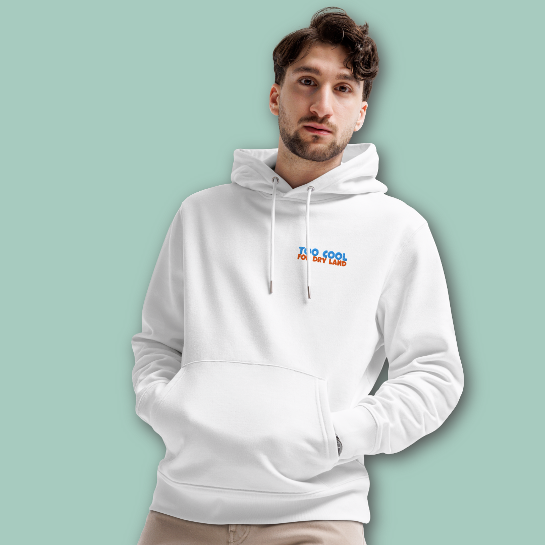 A man wearing an organic hoodie in white with "Too Cool For Dry Land" embroidery in blue and orange, designed by Lane Line Threads for swimmer recovery and skin health.