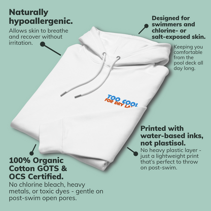 A folded organic hoodie in white with "Too Cool For Dry Land" embroidery in blue and orange, designed by Lane Line Threads for swimmer recovery and skin health with callout text describing product benefits.