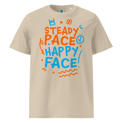 Beige organic cotton t-shirt with a bright orange and blue graphic text that reads "Steady Pace, Happy Face!" Perfect post-swim comfort shirt for a marathon swimmer or long distance swimmer to prevent post-swim skin rash.