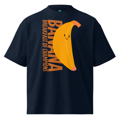A navy short-sleeve crewneck organic oversized t-shirt by Lane Line Threads featuring a graphic print of a smiling yellow banana with the text 'BANANA BREAKFAST OF CHAMPIONS' in brown.