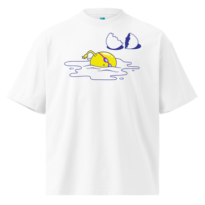 A white short-sleeve crewneck organic oversized t-shirt by Lane Line Threads featuring a graphic print of a yellow cartoon egg yolk swimmer character breaking an egg on a white background.