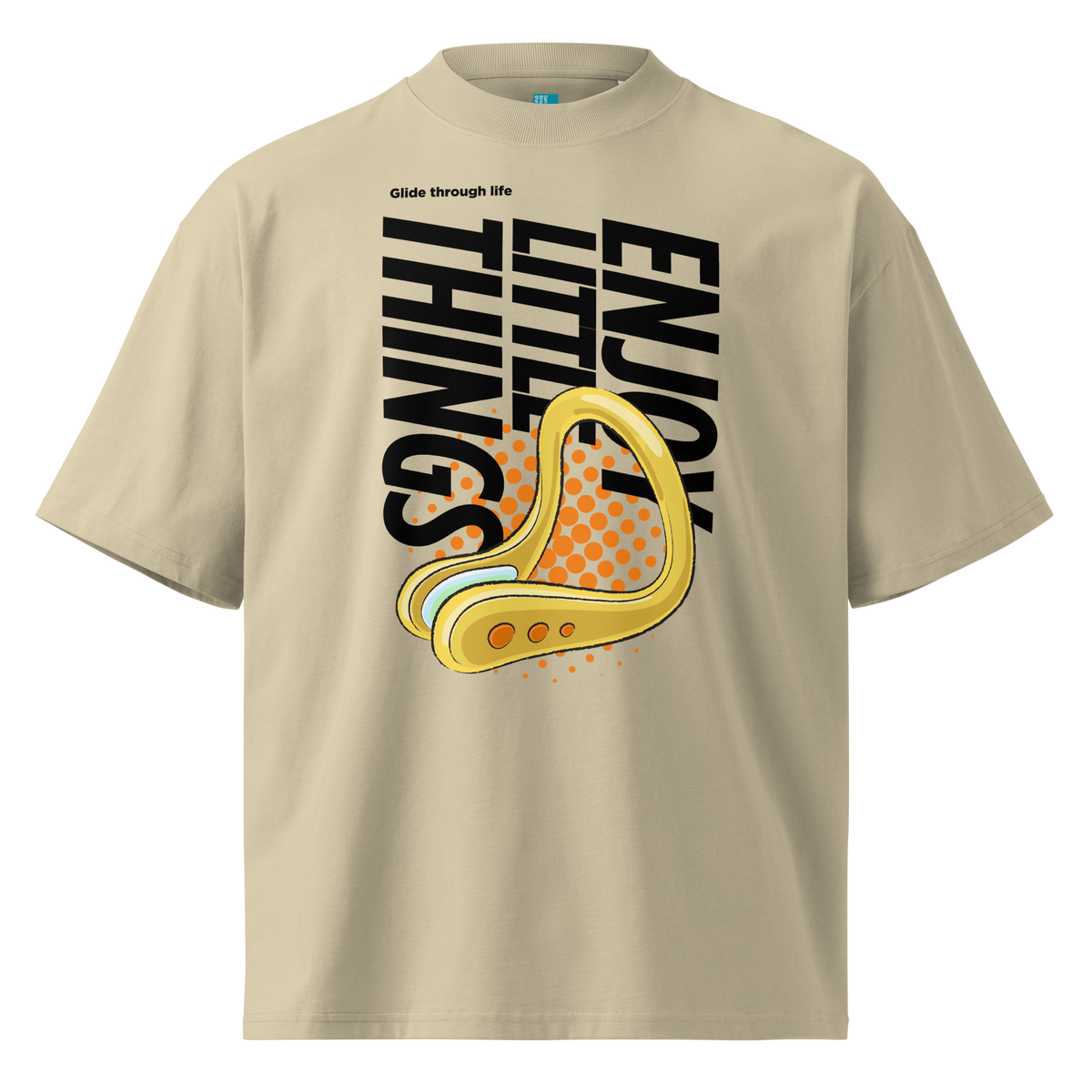 A beige short-sleeve crewneck organic oversized t-shirt by Lane Line Threads featuring a bold graphic print on the front. The design includes the text 'Enjoy Little Things' in black, a gold-colored swimming nose clip illustration, and a halftone pattern in orange.