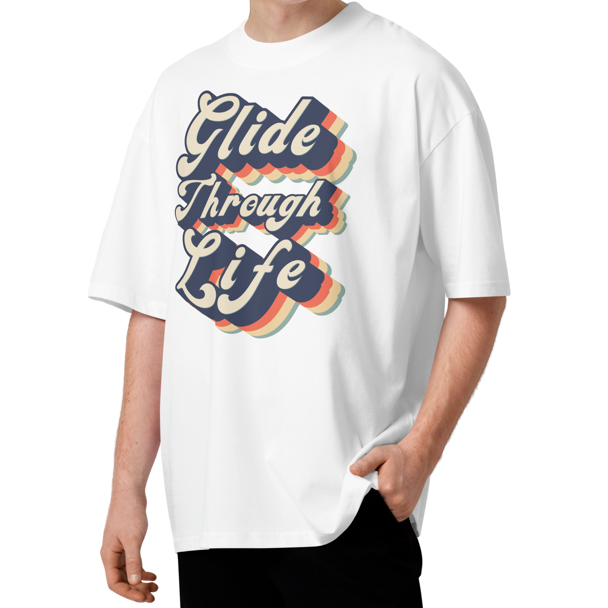 A young man with curly brown hair wearing an organic oversized t-shirt by Lane Line Threads in white with retro “Glide Through Life” layered swim graphic