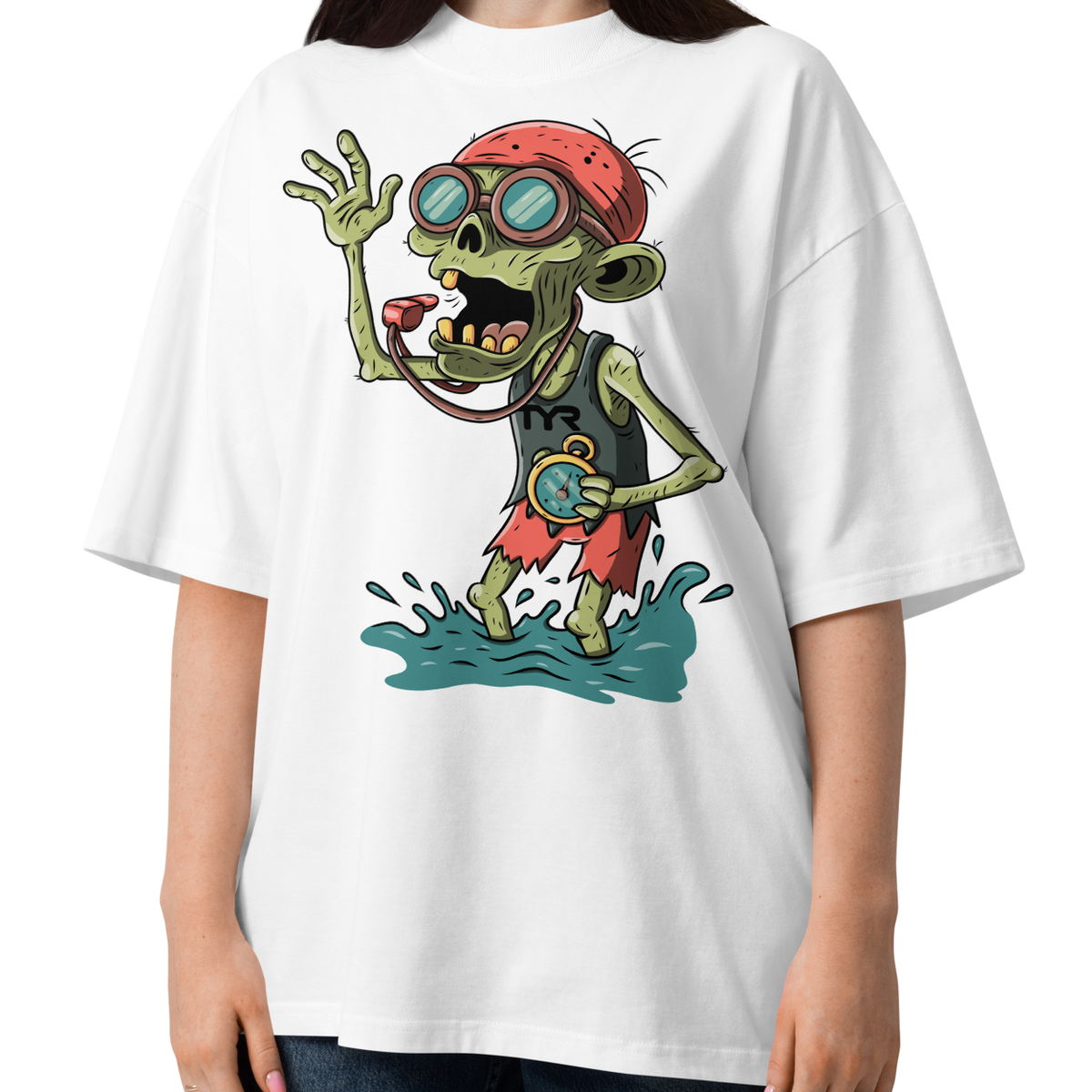 A woman wearing a white short-sleeve crewneck Halloween organic oversized t-shirt by Lane Line Threads, featuring a colorful graphic of a zombie wearing a red swimming cap, swim goggles, and a black TYR tank, standing in splashing water.