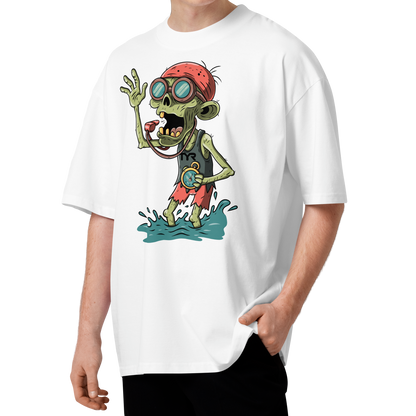 A young man with curly brown hair wearing a white short-sleeve crewneck Halloween organic oversized t-shirt by Lane Line Threads, featuring a colorful graphic of a zombie wearing a red swimming cap, swim goggles, and a black TYR tank, standing in splashing water.