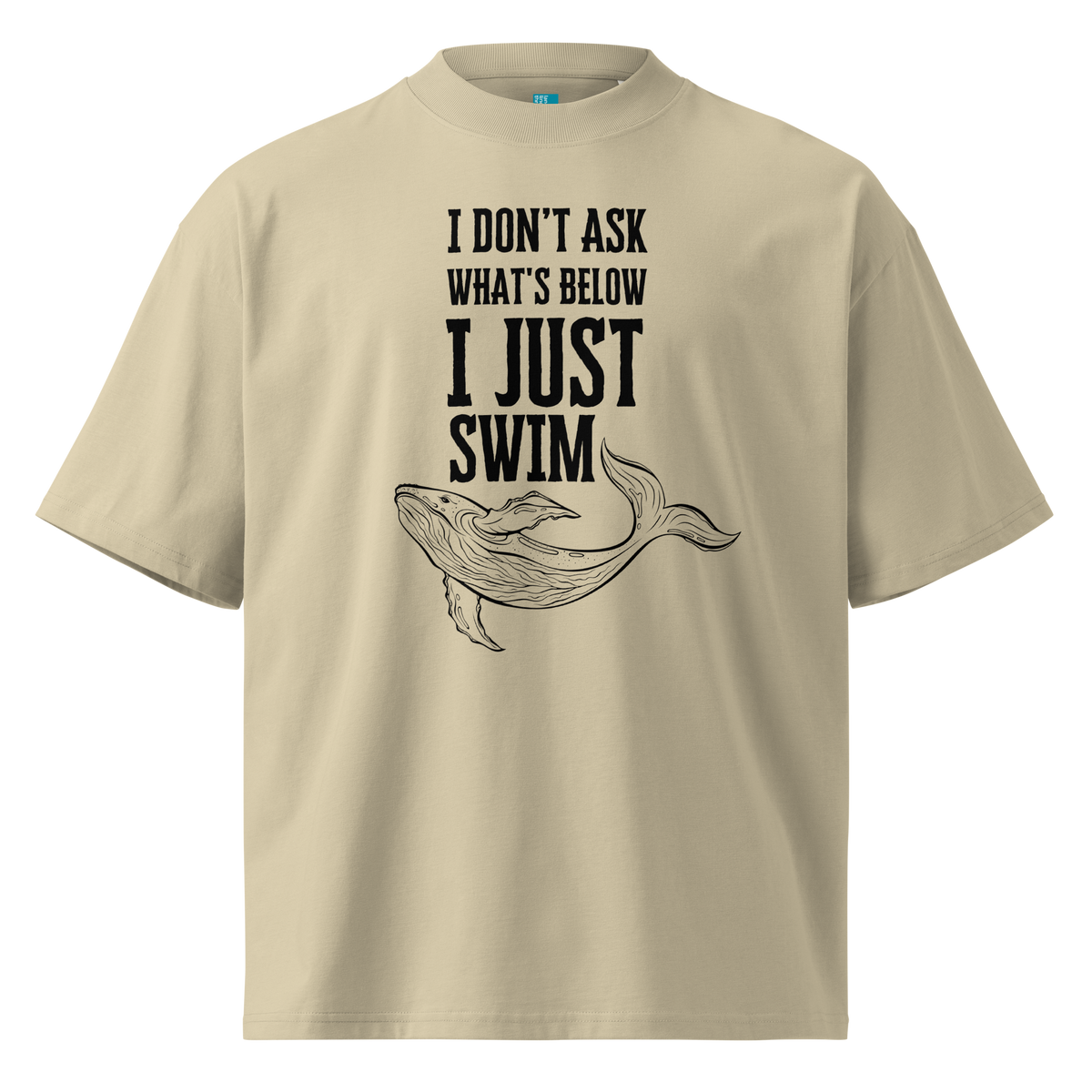 Organic oversized t-shirt in beige with whale graphic and “I DON’T ASK WHAT’S BELOW I JUST SWIM” design