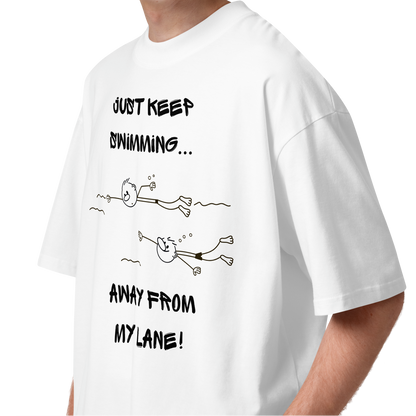 A young man wearing an organic oversized t-shirt in white with a stick-figure drawing of two swimmers and the text Just keep swimming away from my lane by Lane Line Threads.