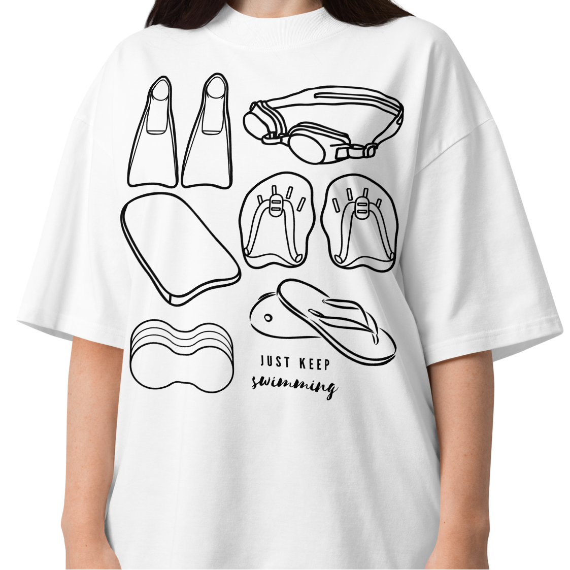 A woman wearing a short-sleeve organic oversized t-shirt by Lane Line Threads with a black line art graphic of swimming gear, including flippers, goggles, paddles, kickboard and a flip-flop, with the text 'JUST KEEP swimming' printed on the front.