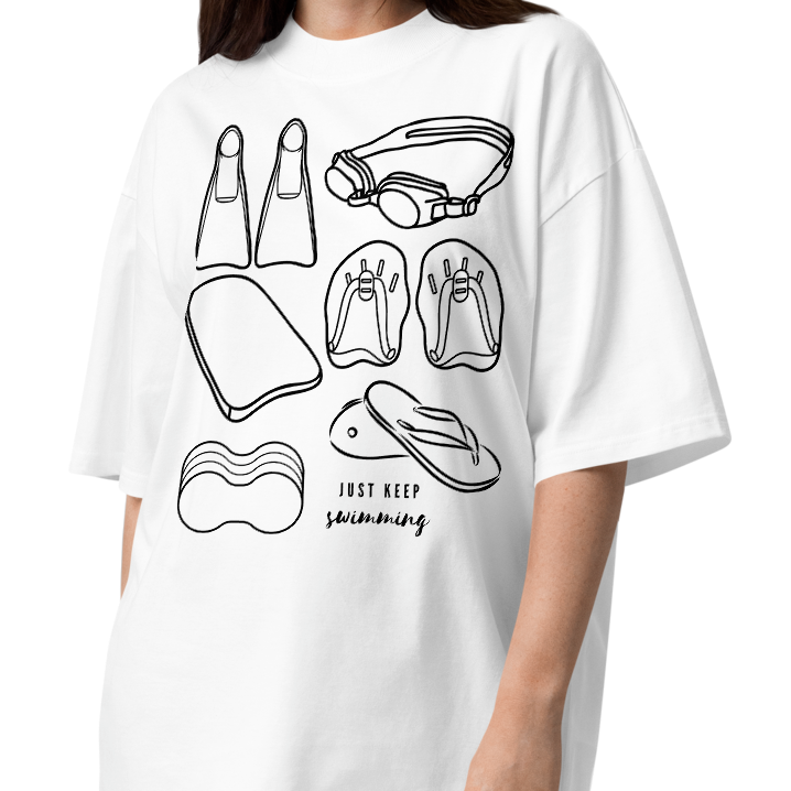 Person wearing a short-sleeve organic oversized t-shirt by Lane Line Threads with a black line art graphic of swimming gear, including flippers, goggles, paddles, kickboard and a flip-flop, with the text 'JUST KEEP swimming' printed on the front.