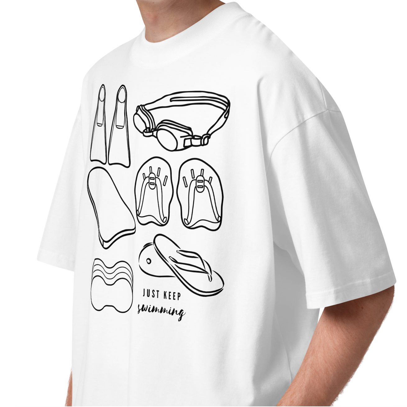 A young man with curly brown hair wearing a white organic oversized t-shirt by Lane Line Threads with a black line art graphic of swimmers' gear items and the text 'JUST KEEP Swimming'.