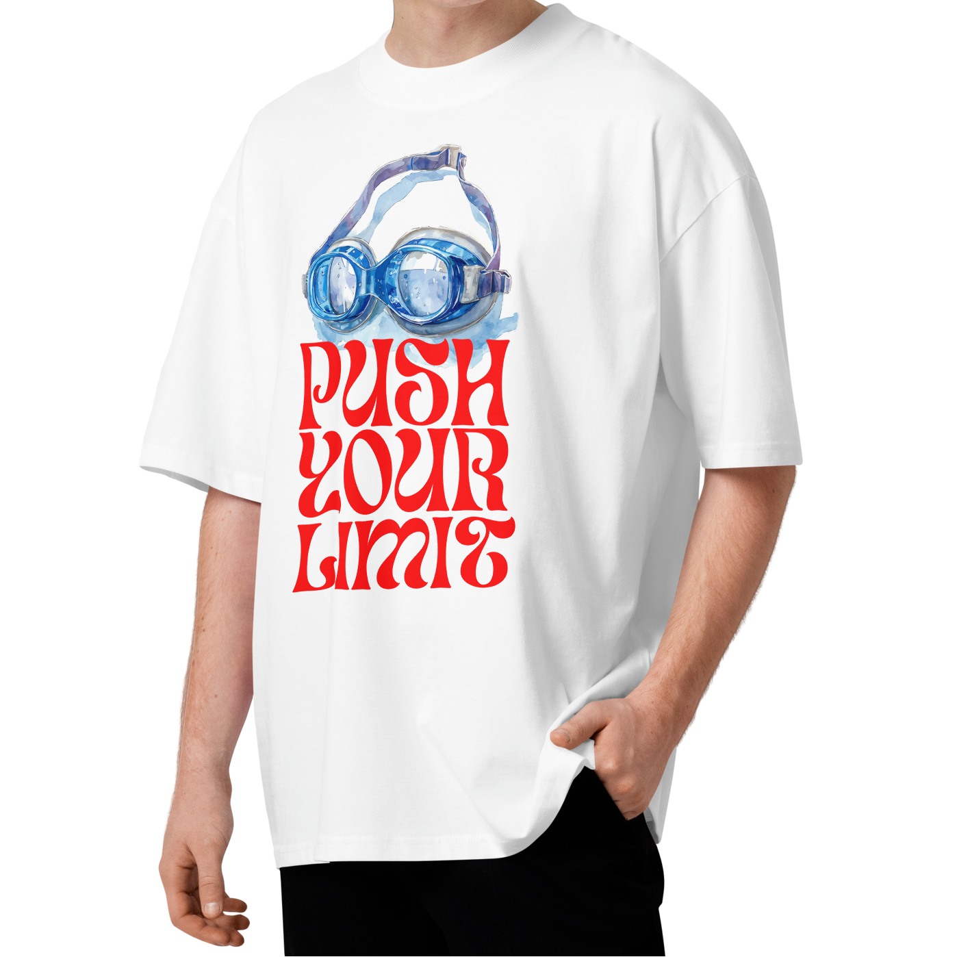 A young man wearing a white short-sleeve crewneck organic oversized t-shirt by Lane Line Threads featuring a graphic print of blue swim goggles above the text 'PUSH YOUR LIMIT' in a bold red retro font.