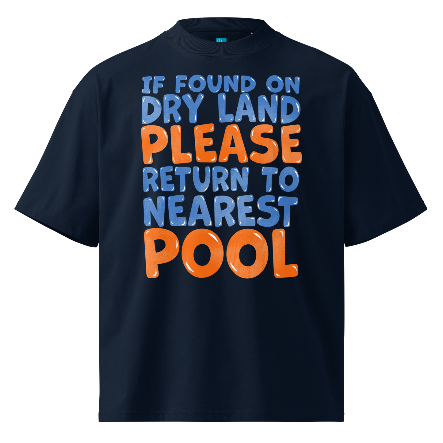 A navy blue short-sleeve organic oversized t-shirt with a bold graphic text print on the front reading 'IF FOUND ON DRY LAND PLEASE RETURN TO NEAREST POOL' in light blue and orange lettering, shown against a plain white background.
