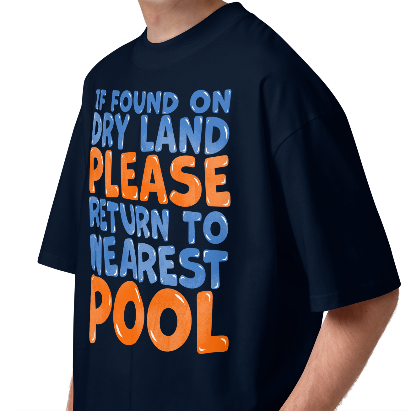 A young man wearing a navy-blue organic oversized t-shirt with a humorous slogan printed on the front in blue and orange text, set against a plain white background.