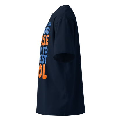 A navy blue short-sleeve organic oversized t-shirt shown from a left side profile view, featuring a large graphic text print on the back in orange and light blue.