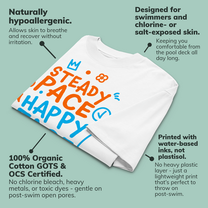 A white short-sleeve crewneck organic oversized t-shirt by Lane Line Threads featuring a colorful graphic print on the front with the words 'STEADY PACE HAPPY FACE' in orange and blue hand-drawn lettering laid flat on a pale green background with callout text describing its features. 