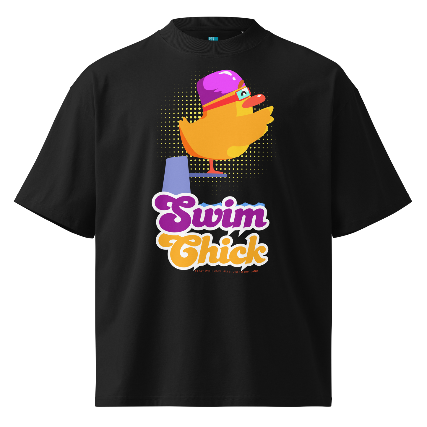 A black short-sleeve crewneck organic oversized t-shirt by Lane Line Threads featuring a colorful graphic of a yellow duck wearing a purple swim cap and goggles, with the text 'Swim Chick' printed below in purple and orange.