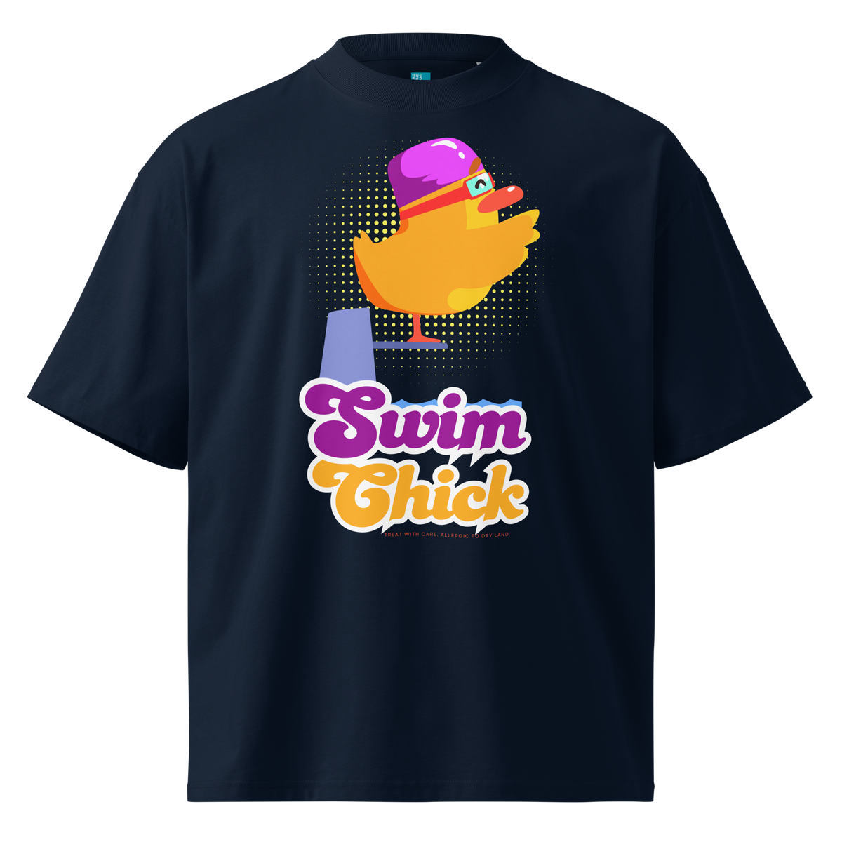 A navy short-sleeve crewneck organic oversized t-shirt by Lane Line Threads featuring a colorful graphic of a yellow duck wearing a purple swim cap and goggles, with the text 'Swim Chick' printed below in purple and orange.