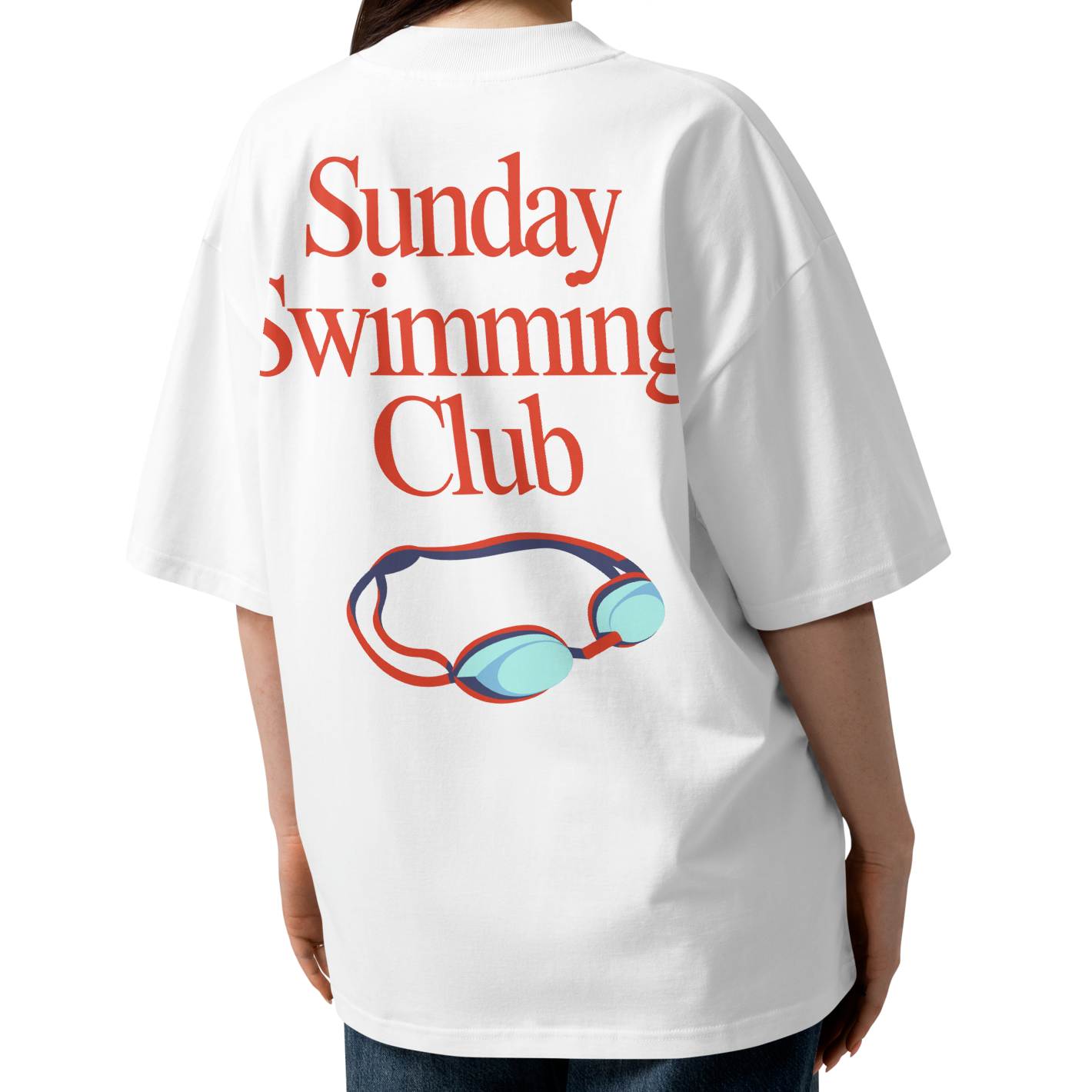 A woman shown from the back wearing a white organic oversized t-shirt with a red graphic text reading 'Sunday Swimming Club' and a blue and red pair of goggles illustration.