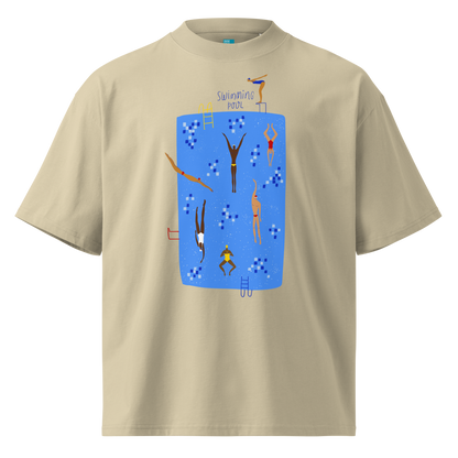 A beige short-sleeve crewneck organic oversized t-shirt by Lane Line Threads featuring a colorful graphic print of a swimming pool with various stylized swimmers and divers on a clean background.