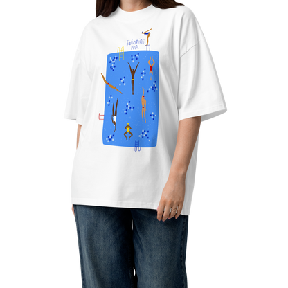 A woman modeling a white short-sleeve crewneck organic oversized t-shirt by Lane Line Threads featuring a colorful graphic print of a swimming pool with various stylized swimmers and divers on a clean background.