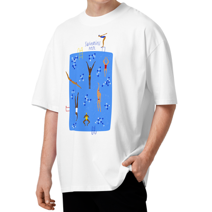 A young man with curly brown hair wearing a white short-sleeve crewneck organic oversized t-shirt by Lane Line Threads featuring a colorful graphic print of a swimming pool with various stylized swimmers and divers on a clean background.