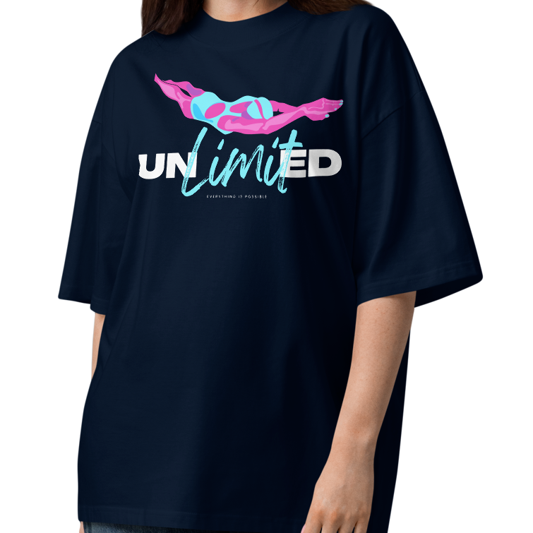 A woman modeling an organic oversized t-shirt in French navy with colorful swimmer illustration and bold “UNLIMITED” graphic