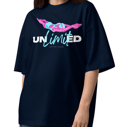 A woman modeling an organic oversized t-shirt in French navy with colorful swimmer illustration and bold “UNLIMITED” graphic