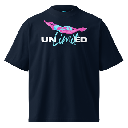A navy blue short-sleeve organic oversized t-shirt by Lane Line Threads with a graphic on the chest featuring a pink and blue female swimmer silhouette above the text 'UNlimited' in white and light blue.