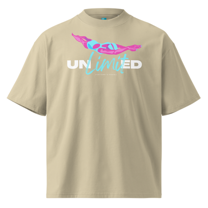 A beige short-sleeve organic oversized t-shirt by Lane Line Threads with a graphic on the chest featuring a pink and blue female swimmer silhouette above the text 'UNlimited' in white and light blue.