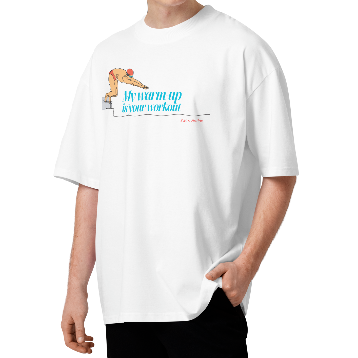 A young man wearing a white short-sleeve crewneck organic oversized t-shirt by Lane Line Threads featuring a graphic of a swimmer on a diving block with the text 'My warm-up is your workout' in blue and 'Swim Nation' in red below, paired with black pants, standing against a solid white background.