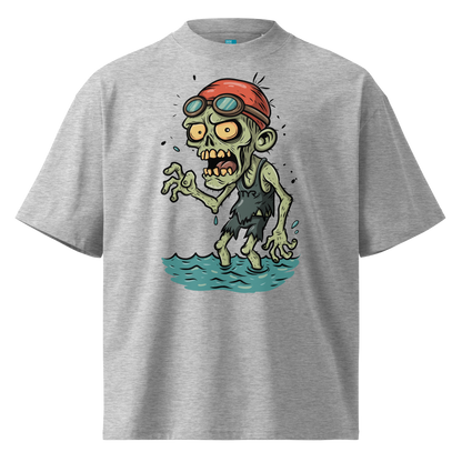A grey short-sleeve crewneck organic oversized t-shirt by Lane Line Threads, featuring a cartoon graphic of a zombie wearing a red swim cap and goggles, standing in water.