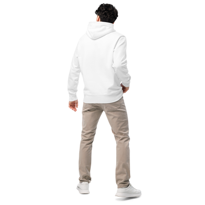 Person wearing a white post swim organic hoodie and beige pants on a white background