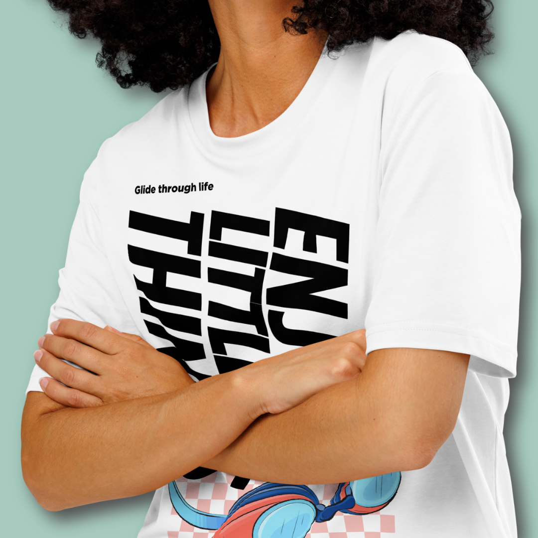 Person wearing a white organic post swim shirt with black swim-themed text on a light green background