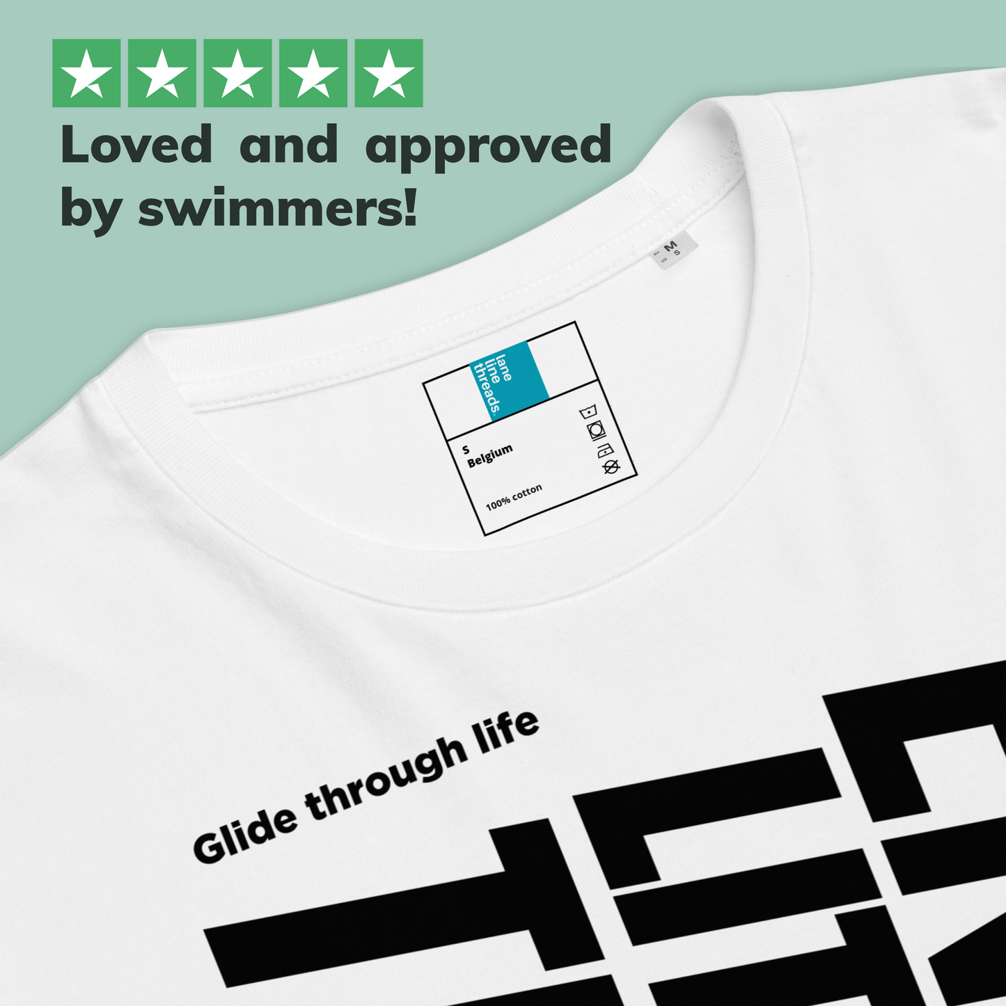 White organic post swim shirt with black swim-themed text and graphics, featuring a label and text 'Loved and approved by swimmers!'.